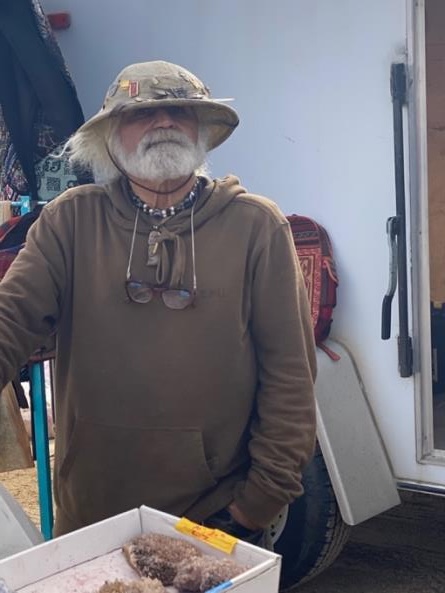 A cool guy selling crystals at the swap meet on the grounds of the Institute for MentalPhysics in the Mojave Desert.