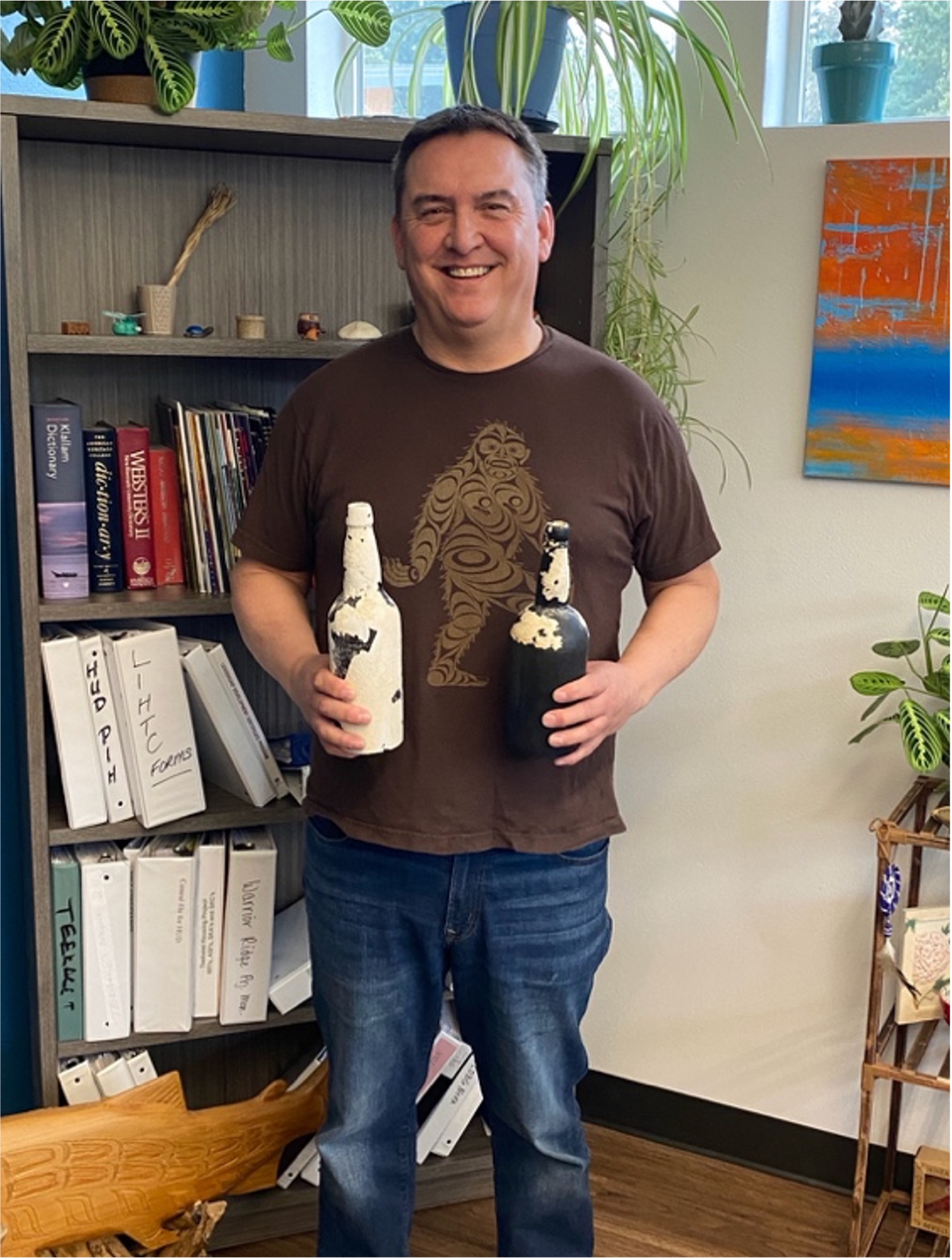 Geoduck Diver Chad Sullivan with bottles he recovered from Port Gamble Bay. He’s not talking.
